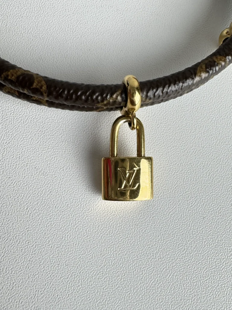 Pre Owned Louis Vuitton Keep It Twice Brass Charm Bracelet with Gold Padlock Closure and Monogram Pattern
